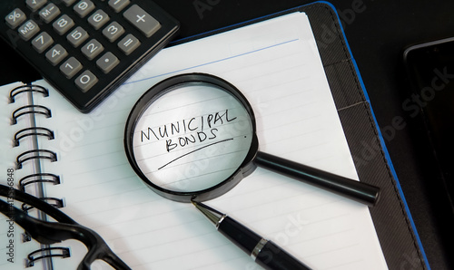 Municipal bond written on a book and documents.
