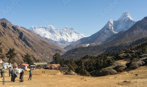 tourists in the mountains, Tengboche village in Nepal on the way to Everest Base Camp, trekking and travelling concept, active travel, hiking and trekking in the Himalayas photo