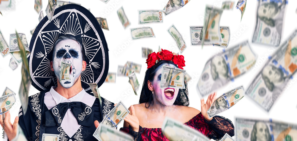 Young couple wearing mexican day of the dead costume over background celebrating mad and crazy for success with arms raised and closed eyes screaming excited. winner concept