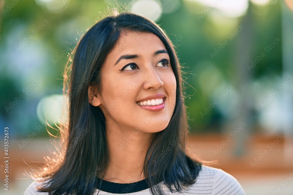 Young hispanic woman smiling happy walking at the park Young hispanic woman smiling happy walking at the park