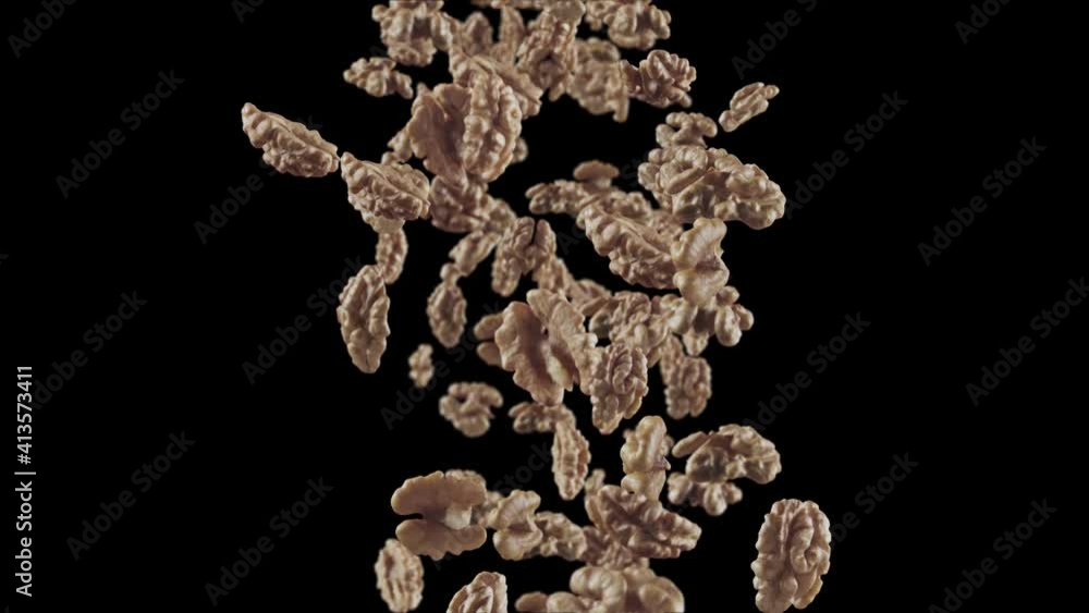 Falling of Walnuts in Black Background Falling of Walnuts in Black Background