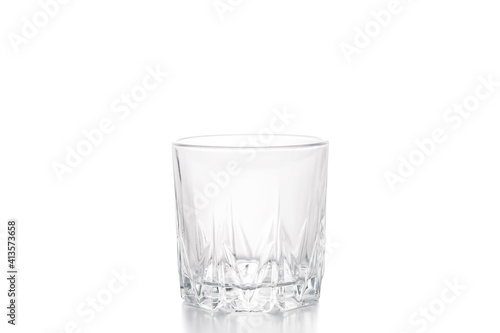 Empty whiskey glass. Transparent glass old-fashion glass isolated on a white background.