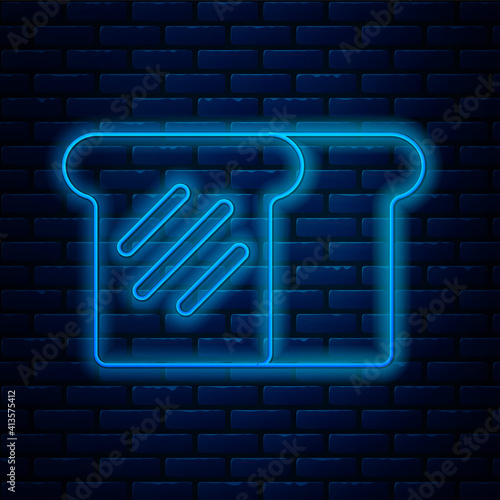 Glowing neon line Bread toast for sandwich piece of roasted crouton icon isolated on brick wall background. Lunch, dinner, breakfast snack. Vector.