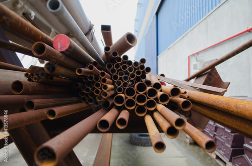 Corroded steel pipes on a shelf