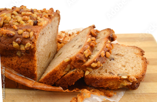 Delicious freshly baked banana bread on wooden board