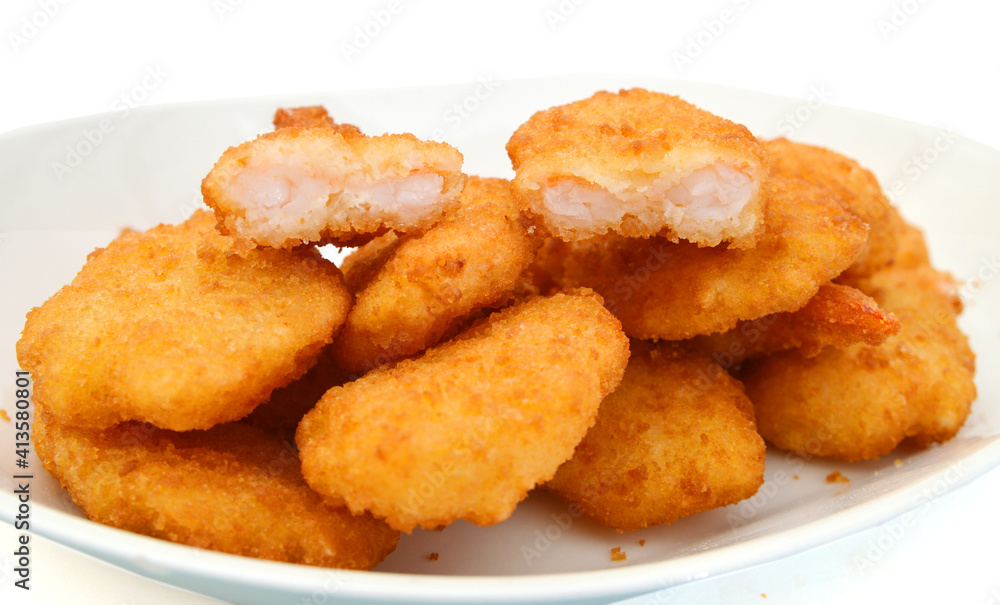 Breaded Butterfly Prawns - Deep fried battered prawns filled in plate on white background Breaded Butterfly Prawns - Deep fried battered prawns filled in plate on white background