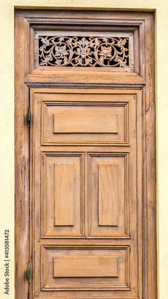 The door of an old house with an ornament in the upper part on in Sri Lanka The door of an old house with an ornament in the upper part on in Sri Lanka