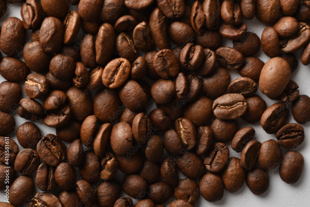 Coffee beans isolated on white background with copy space for text. Coffee background or texture concept. Coffee beans isolated on white background with copy space for text. Coffee background or texture concept.