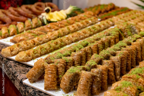 Pistachio baklava. Traditional Middle Eastern Flavors. Traditional Turkish baklava. Local name fistikli baklava photo