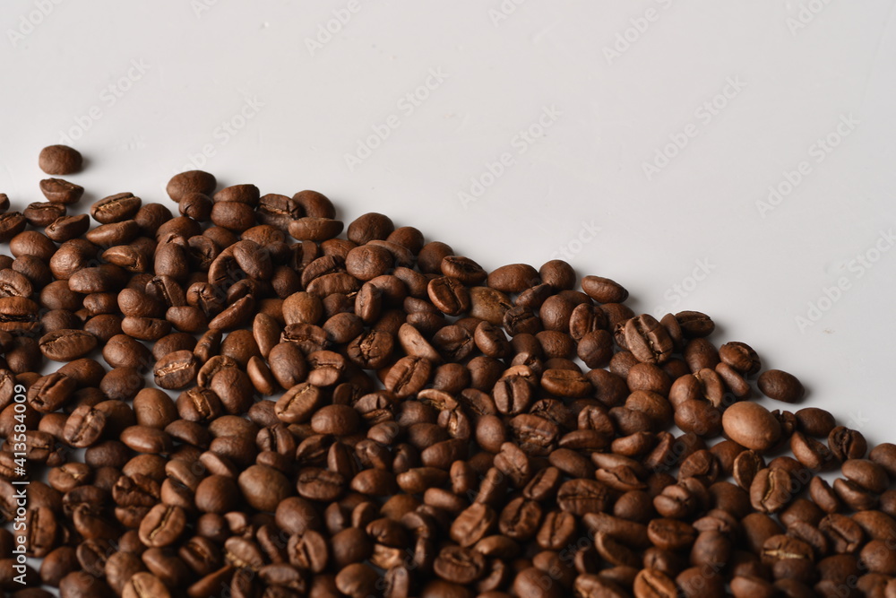 Coffee beans isolated on white background with copy space for text. Coffee background or texture concept. Coffee beans isolated on white background with copy space for text. Coffee background or texture concept.
