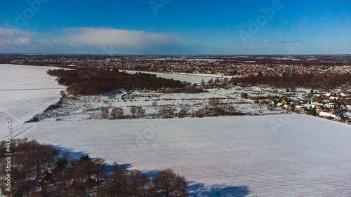 A birds eye view of the snow covered landscape in a rural part of Suffolk, UK