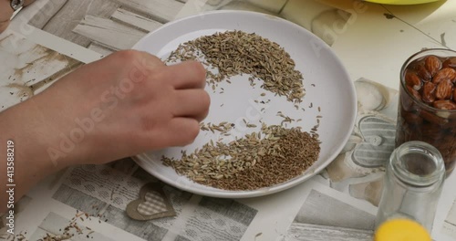 a hand sieving and cleaning seeds, remove impurity of anise and fennel seeds