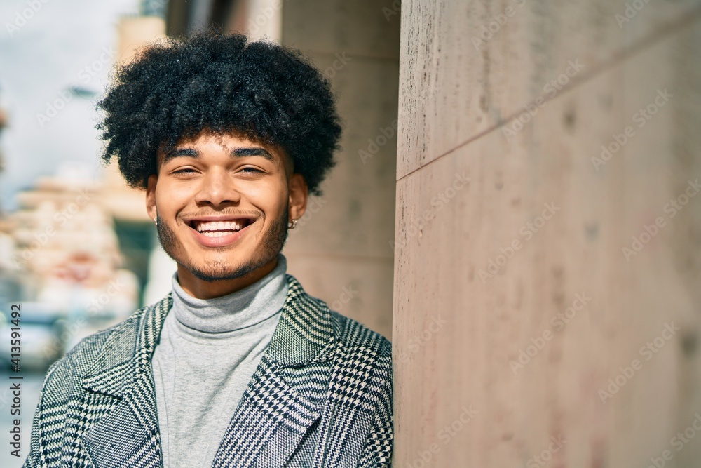 Young african american businessman smiling happy standing at the city. Young african american businessman smiling happy standing at the city.