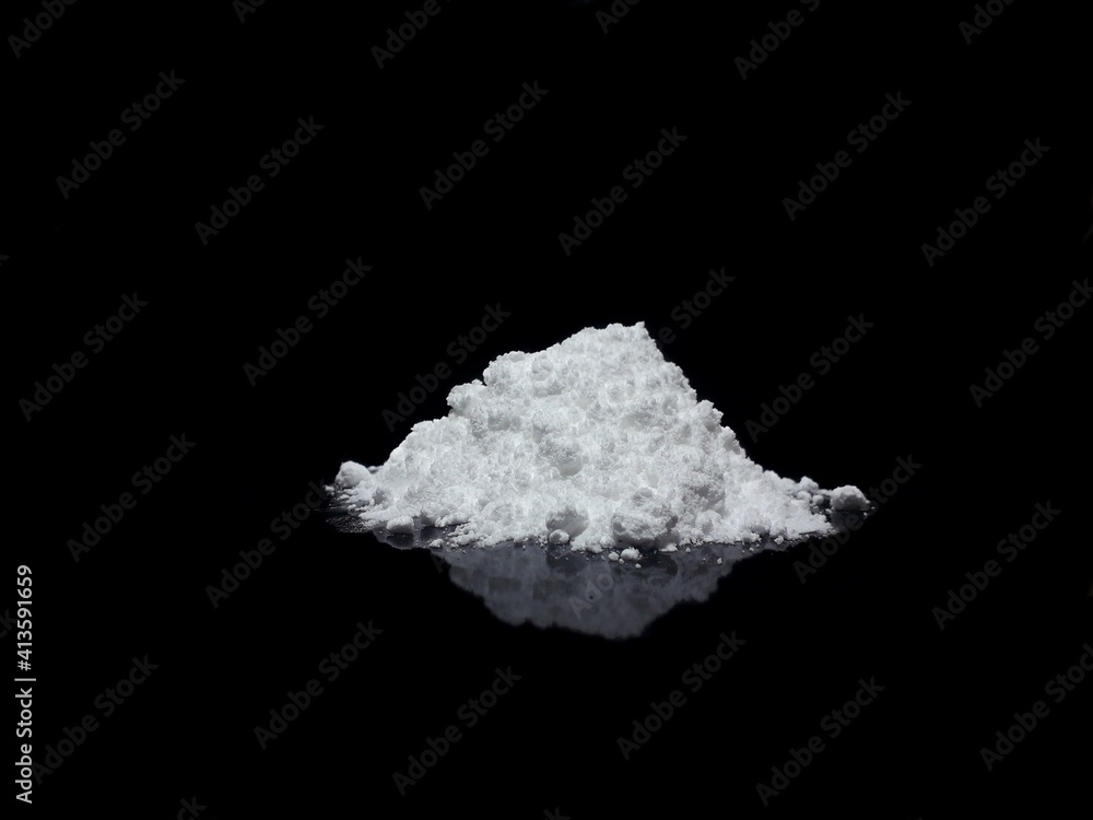 Cocaine drug powder pile on black background Cocaine drug powder pile on black background