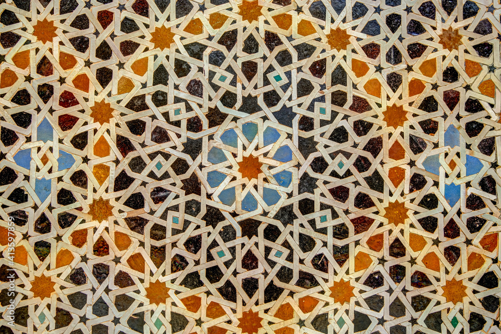 Intricate tile patterns, metal work and plaster carvings adorning  building exteriors in Fez Morocco