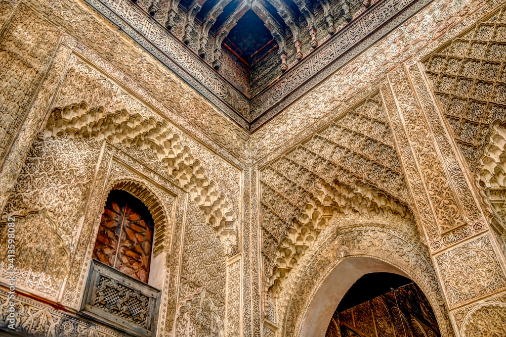 Intricate tile patterns, metal work and plaster carvings adorning  building exteriors in Fez Morocco