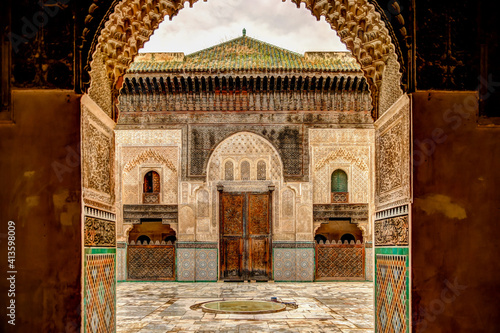 Intricate tile patterns, metal work and plaster carvings adorning building exteriors in Fez Morocco