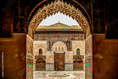 Intricate tile patterns, metal work and plaster carvings adorning  building exteriors in Fez Morocco