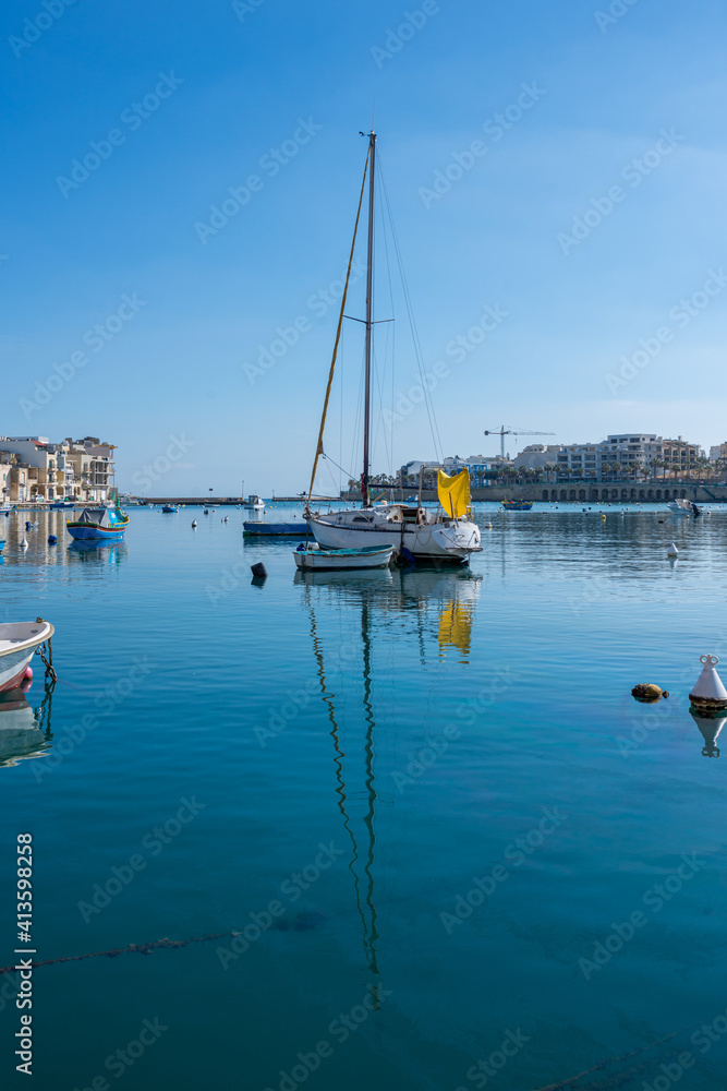 Obraz premium Colorful Boats in Harbor of Marsaxlokk Malta at springtime