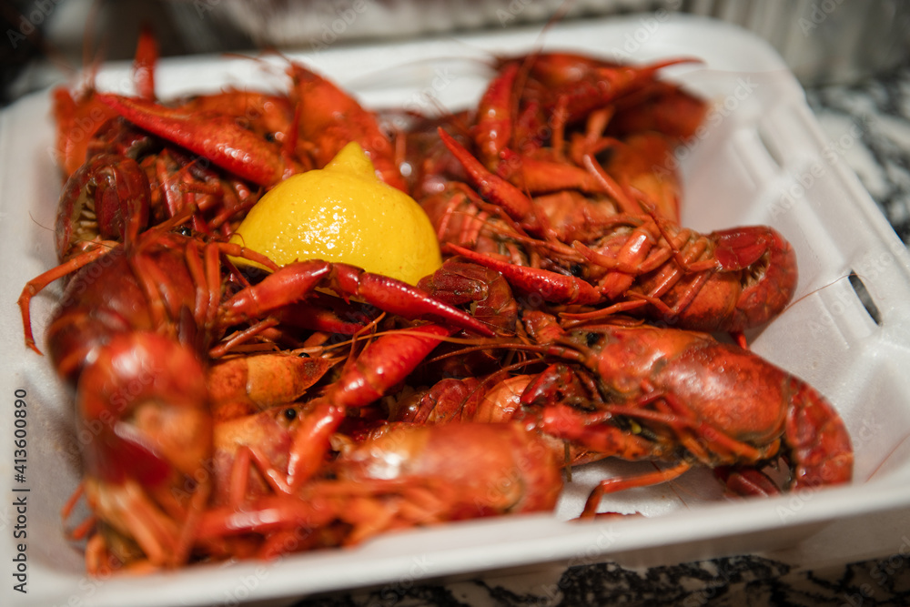 overhead closeup view of a large quantity of cooked crawfish ready to