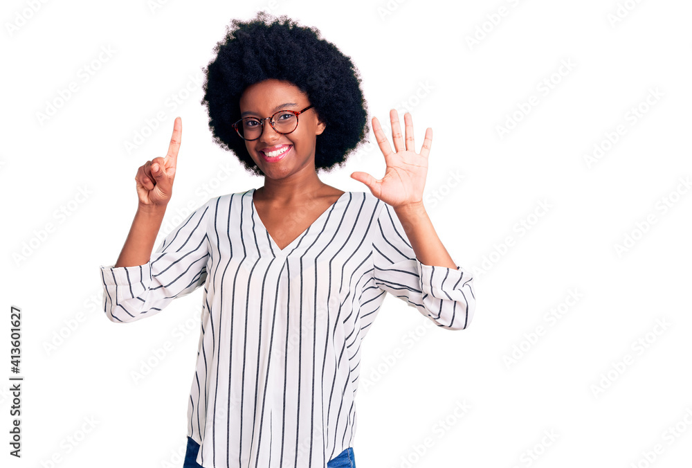 Young african american woman wearing casual clothes and glasses showing and pointing up with fingers number six while smiling confident and happy. Young african american woman wearing casual clothes and glasses showing and pointing up with fingers number six while smiling confident and happy.
