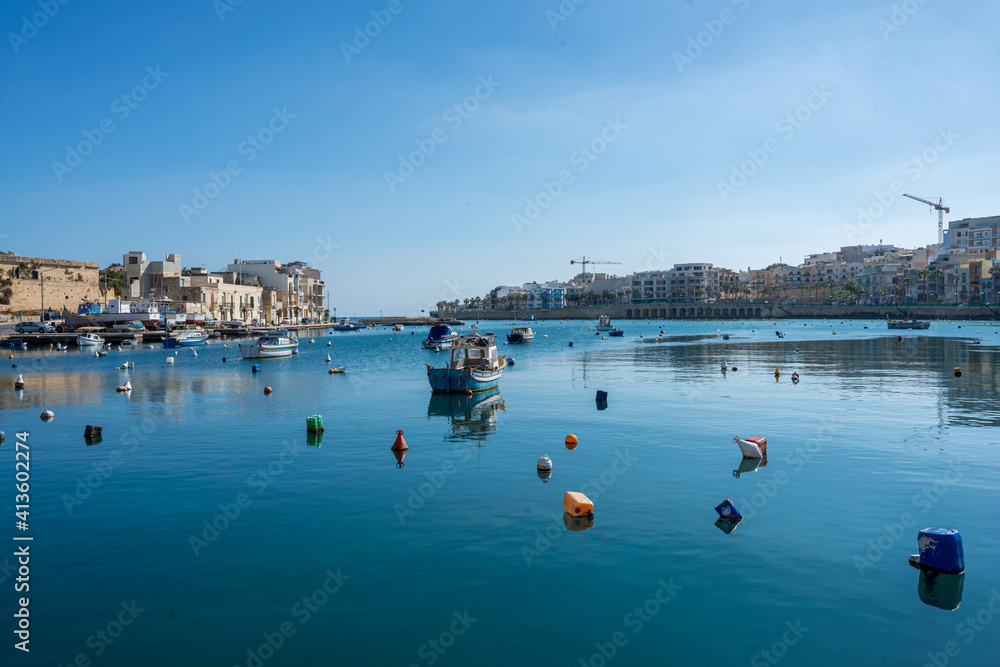 Colorful Boats in Harbor of Marsaxlokk Malta at springtime