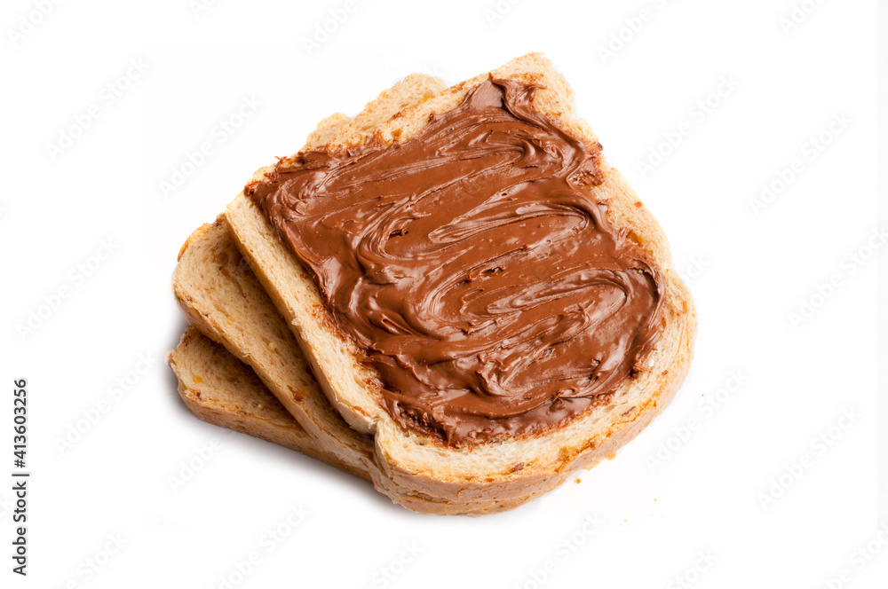 Slices of cereal bread with chocolate hazelnut cream spread isolated on white background Slices of cereal bread with chocolate hazelnut cream spread isolated on white background