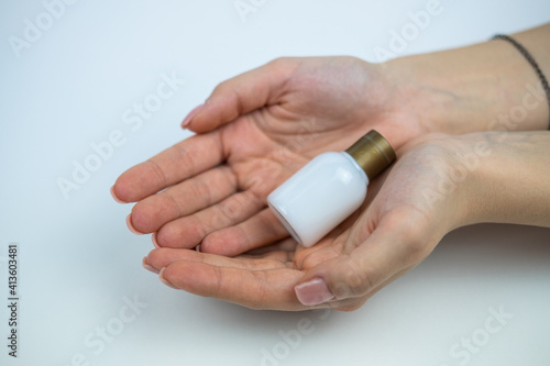 Photo of someone holding a body lotion from a hotel