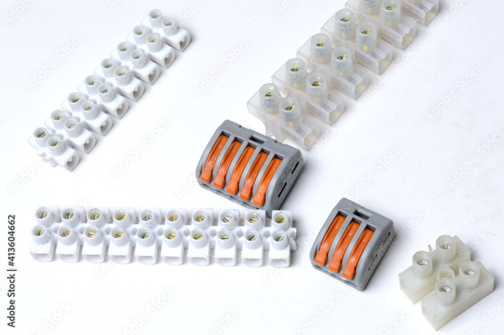 electrical terminal blocks lies on a light background. close-up. electrical terminal blocks lies on a light background. close-up.