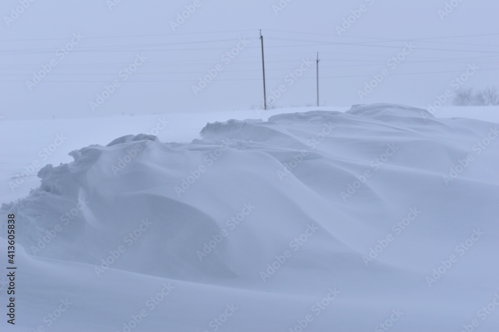 Snowdrift of white snow in the field. Snowdrift of white snow in the field.