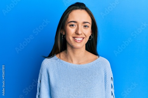 Young hispanic girl wearing casual clothes with a happy and cool smile on face. lucky person.