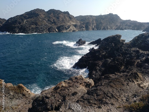 Vista del Cap de Creus desde la playa de Cala Culip. Paisaje agreste y salvaje con montañas de roca y agua como paisaje.  photo