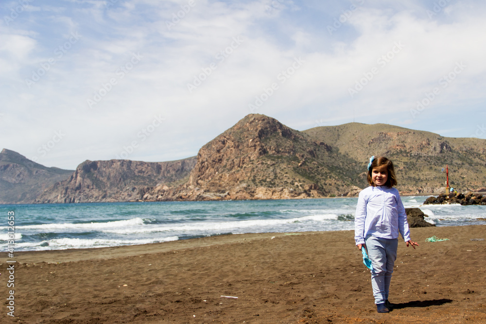 quiet girl on the beach on an autumn day