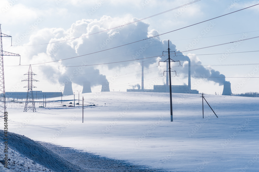 Thermal power plant pipes in winter. Industrial landscape. Thermal power plant pipes in winter. Industrial landscape.