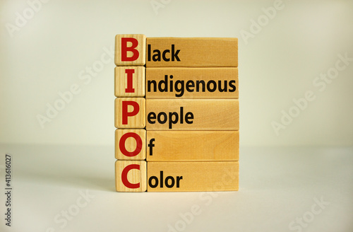 BIPOC symbol. Abbreviation BIPOC, black, indigenous and people of color on wooden cubes. Beautiful white background. Copy space. Business and BIPOC, black, indigenous and people of color concept.