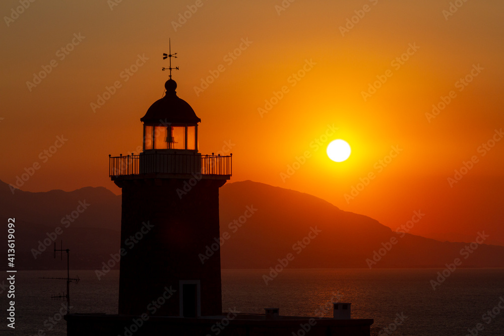 The lighthouse of Melagavi during sunset, near the cities of Loutraki and Corinth, in Peloponnese region, Greece, Europe