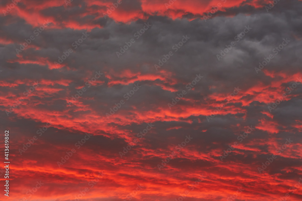 Sunset sky with dark clouds. Beautiful sunset sky. Natural background. Without Filters. Dramatic Sky. Natural cloud landscape.