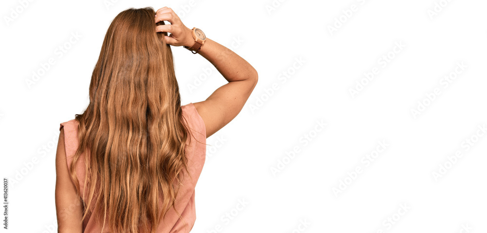 Young hispanic woman wearing casual clothes and glasses backwards thinking about doubt with hand on head Young hispanic woman wearing casual clothes and glasses backwards thinking about doubt with hand on head