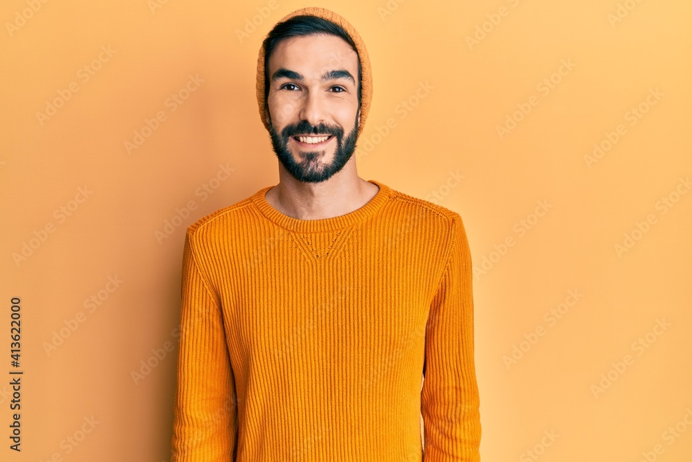 Young hispanic man wearing casual clothes with a happy and cool smile on face. lucky person. Young hispanic man wearing casual clothes with a happy and cool smile on face. lucky person.
