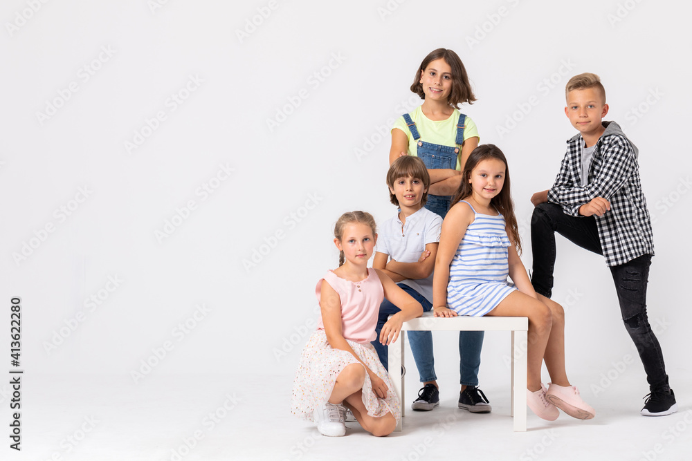 Group of cool children fooling around and making funny poses Group of cool children fooling around and making funny poses