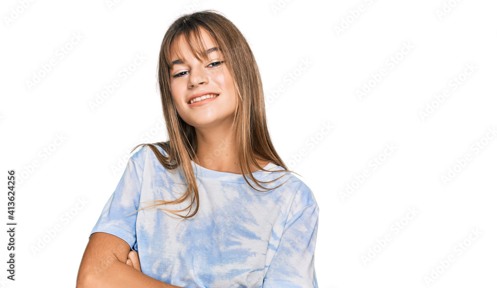 Teenager caucasian girl wearing casual clothes happy face smiling with crossed arms looking at the camera. positive person. Teenager caucasian girl wearing casual clothes happy face smiling with crossed arms looking at the camera. positive person.