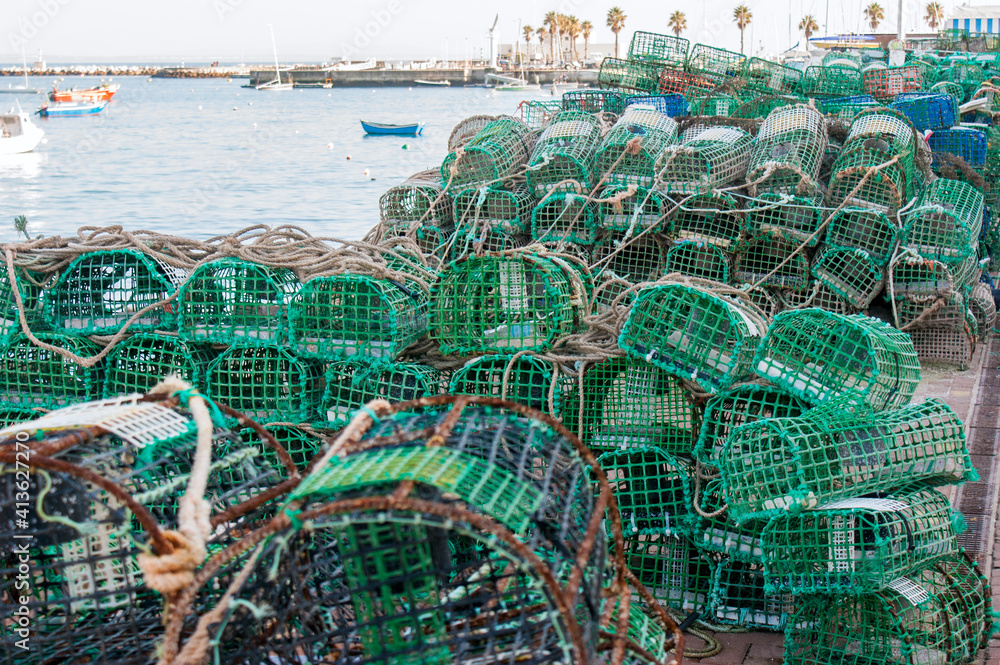 Obraz premium Ropes, nets and handcrafted fishing traps for the octopus, lobsters and crabs in the fishing port of Cascais, Portugal