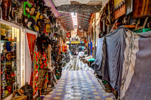 Marrakech, Morocco - April 5, 2019: The buildings and busy walkways and shops in the souks of Marrakech Morocco.