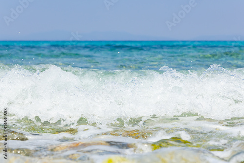 Sea wave and pebble. Summer vacation concept. Sea wave with foam. Travel concept