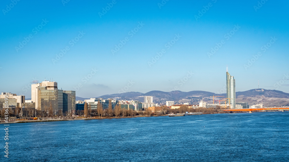 Fototapeta premium Vienna Danube and 2nd district on a beautiful day with blue sky.