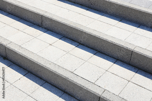 Steps made of curbstone and granite tiles