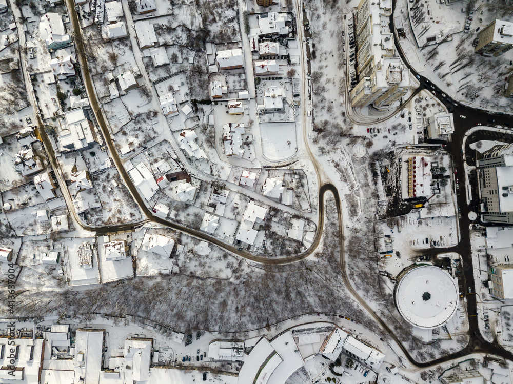 Obraz premium Snowy Kiev. Aerial drone view. Winter sunny morning.