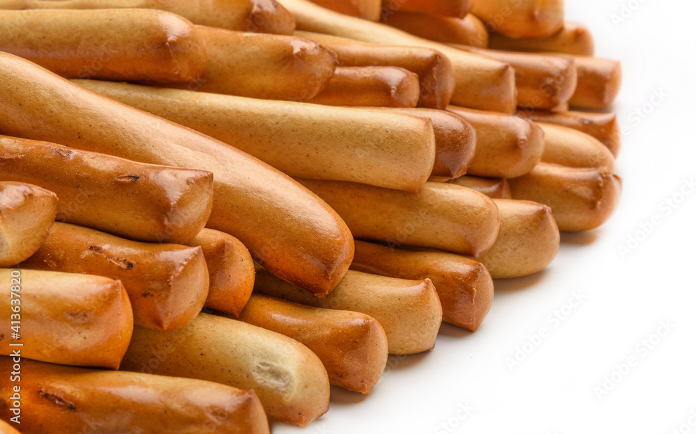 Bread sticks close up isolated on white. Fresh baked goods. Bread sticks close up isolated on white. Fresh baked goods.