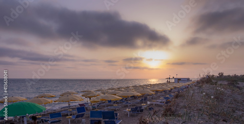 Summertime: beach sunset. Torre Mozza Beach, with its of coast with fine sand, is one of the longest and most appealing among those in the South part of Salento in Apulia, Italy.