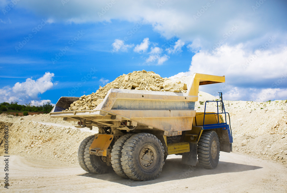 Obraz premium A large quarry dump truck loaded with rock.